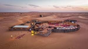 Luxury desert camp with gourmet BBQ and live shows